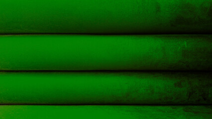 Velvet fabric in a luxury shade of green, arranged in elegant horizontal folds. The plush texture and soft sheen create a luxurious and inviting visual, perfect for backgrounds.