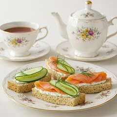 Afternoon tea set with floral porcelain, smoked salmon cucumber tea sandwiches on floral china, ideal for high tea promotions, British cuisine content, or elegant dining features