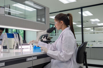 Scientist conducts research in modern laboratory focused on precise experiments with advanced equipment