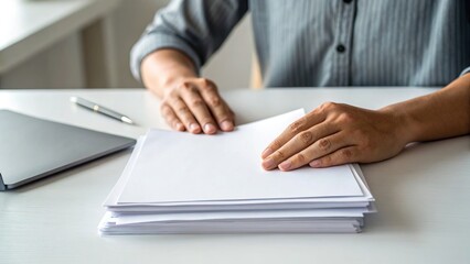Economic recession, saving conscious, A person arranging documents on a desk, organization and focus in a professional environment.