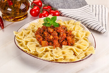 Italian pasta Farfalle Bolognese with meat