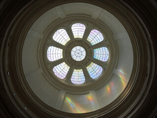 Circular stained glass dome with rainbow light reflections