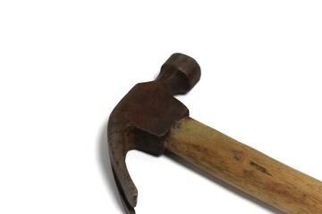 Close-up shot of a weathered wooden-handled claw hammer, showcasing its utilitarian design and