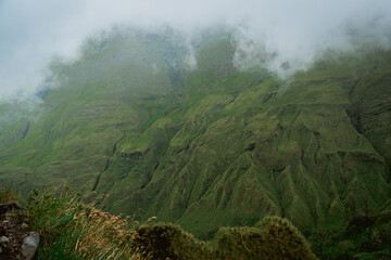 Misty mountain landscape remote location nature scene lush green environment wide angle view tranquil wilderness