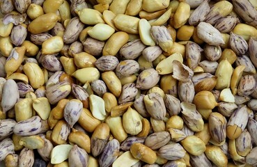 Raw whole Tiger Stripe Peanuts create a vibrant natural food background. Healthy organic striped nuts with rich color, perfect for snack, cooking, and texture concepts.