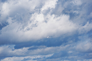 Passenger airplane ascending and leaving Swiss Zurich Airport with cloudy sky background on an autumn day. Photo taken September 15th, 2025, Zurich Kloten, Switzerland.