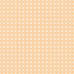 A seamless pattern featuring cream polka dots arranged in a neat grid on a soft peach background. Great for packaging, textiles, wallpaper, and baby items.
