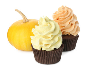 Delicious cupcakes with colorful cream and pumpkin isolated on white