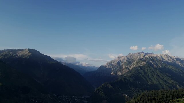Majestic Aerial View of Arang Kel, Azad Kashmir &mdash; Vast Pine Forest Stretching Across Mountain Slopes Beneath Rugged Peaks and Blue Sky in the Heart of the Himalayas
