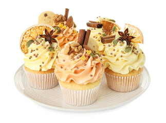 Delicious cupcakes with sprinkles, nuts and spices isolated on white. Autumn atmosphere