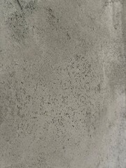 Close-up of textured concrete surface displaying unique patterns and colors, perfect for use in backgrounds, design projects, and creative applications with copy space