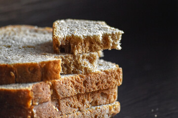 Sliced Bread Close-Up Stack. Stack of brown sliced bread close-up.