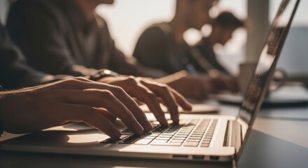 Caucasian male adults working on laptops in modern office setting