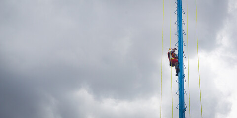 Silhouette of a Papantla flyer descending mid-air during the traditional "Danza de los Voladores." This ritual performance is an important part of Mexico's indigenous heritage.