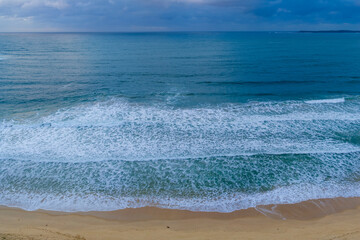Drone aerial photograph of the South Pacific Ocean and beach at Windang Bay near the coastal town of Warilla in the Illawarra region on the south coast of NSW, Australia.