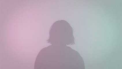 Soft pastel gradient background with silhouette of a person  