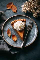 Fototapeta premium Slice of Sweet Potato Pie with Whipped Cream on Ceramic Plate