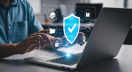 Person using laptop with digital security shield and icons