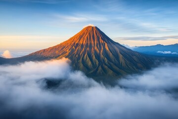 A majestic volcanic peak pierces through a fluffy sea of clouds. This breathtaking natural scene captures the dramatic beauty and power of volcanic landscapes.