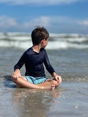 Little boy playing in florida in  the beach cocoa beach 