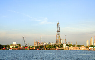 panorama view of Oil and gas industry, factory - petrochemical plant, refinery and transportation under sun light whit beautiful blue sky, Bang jak, Bangkok, Thailand. © MMxeon