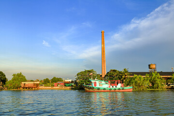 Tug boat, fire boat standby for service near Bang jak petrochemical plant, Bangkok Thailand.
