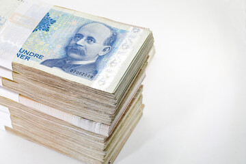 Many packs of Norway krone bills, 200 krone, stacks of banknotes, pile of cash, paper money. The concept of financial success, Investment and wealth. isolate on white background.