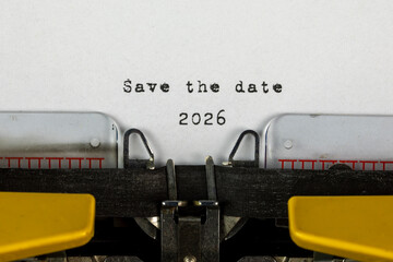 Save the date 2026 written on an old typewriter	
