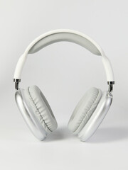 white headphones in a fashionable design on a light background
