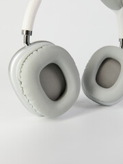 white headphones in a fashionable design on a light background