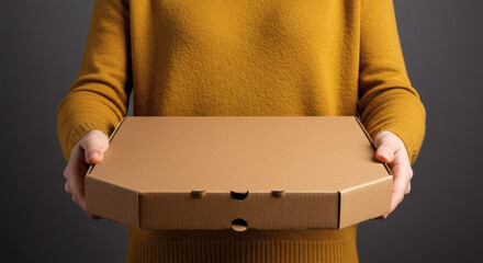 Hands holding blank cardboard pizza box for branding mockup on neutral background