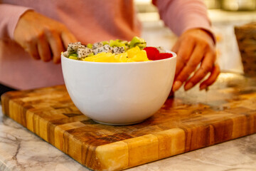 Fresh Fruit Salad in White Bowl on Cutting Board
