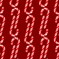 Seamless pattern of red and white striped sugar candy on a red background
