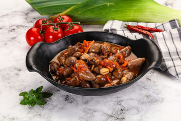 Baked chicken hearts with vegetables