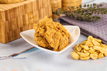 Crunchy peanut butter fat product