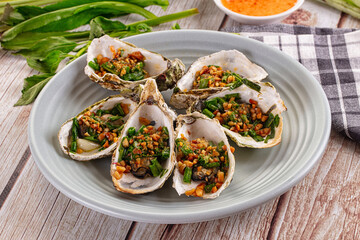 Gournet grilled oysters with onion and peanut