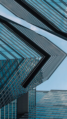 mirrored windows of the facade of an office building