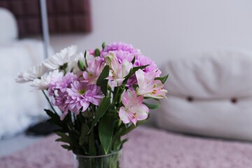 bouquet of flowers, primarily featuring chrysanthemums and gerbera daisies.