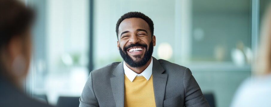 Smiling Business Meeting Joyful African American Man in a Suit, Teamwork ,Leadership - Powered by Adobe