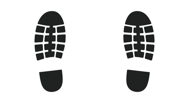 Black footprints on a white background showcasing sole pattern details