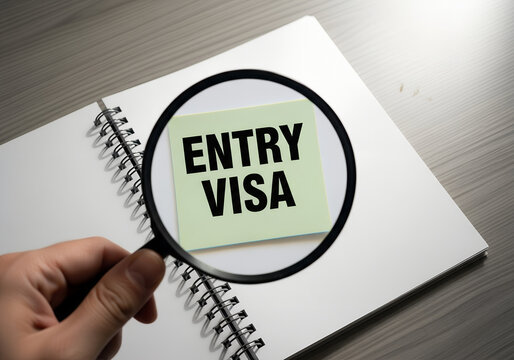 visa application and immigration paperwork, entry permit concept with magnifying glass