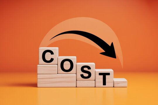 Price drop and financial savings concept. The word COST on wooden blocks with a decreasing arrow indicating a reduction in expenses