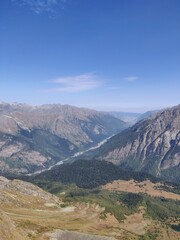 Araffe flying over a mountain with a valley below