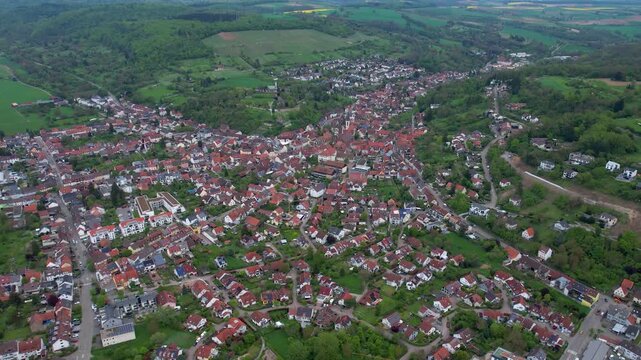 Aerial around the city Weingarten 76356 in Germany on a cloudy spring day.