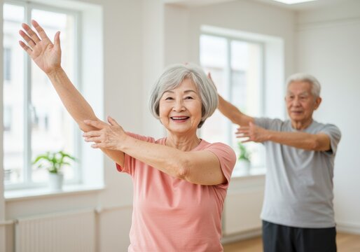 Happy senior couple exercising together indoors