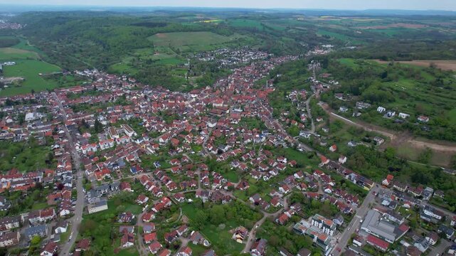 Aerial around the city Weingarten 76356 in Germany on a cloudy spring day.