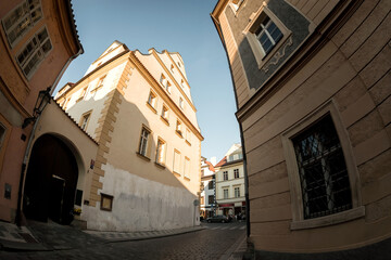Narrow cobblestone street with old buildings in Prague, Czech Republic
