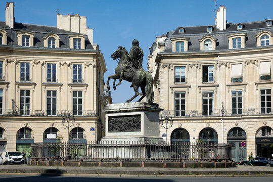 Paris, France. Europe. The circular Place des Victoires, centered around the equestrian statue of Louis XIV in historic Paris.