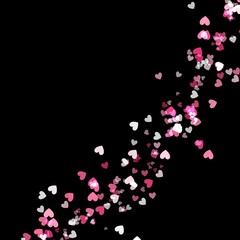 Heart-shaped confetti scattered on a black background  