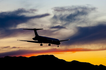 Sunset Landing: A Serene Flight Against a Vibrant Sky
